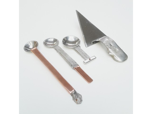 Copper and pewter spoons and cake slice