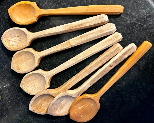 Display of seven hand carved spoons